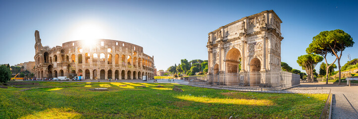 Panorama of Colosseum and Constantine arch at sunrise in Rome, Italy,Europe.