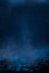 Empty street scene background with abstract spotlights light. Night view of street light reflected on water. Rays through the fog. Smoke, fog, wet asphalt with reflection of lights. 