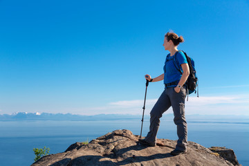 Hiking woman on top of the Mountain in Lofoten Islands, Norway