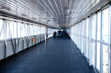 corridor in the port with people