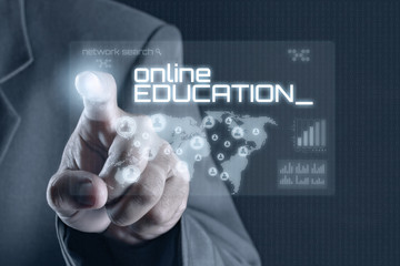 Fototapeta na wymiar Business man pointing to virtual screen. Education & Technology Concept