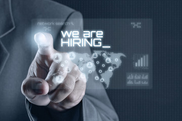 Obraz premium Business man pointing to virtual screen. Business & Technology Concept