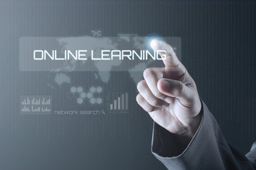 Obraz premium Business man pointing to virtual screen. Education Concept