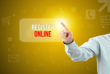 Business man touch a button on an imaginary screen with text REGISTER ONLINE