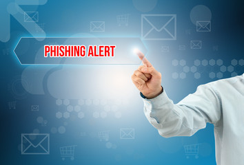 business man touch a button on an imaginary screen with text PHISHING ALERT
