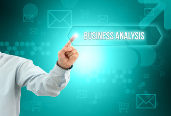 Obraz premium Business man touch a button on an imaginary screen with text BUSINESS ANALYSIS