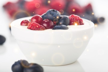 Yogurt with forest berries  on wooden table