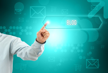 Business man touch a button on an imaginary screen with text BLOG