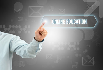 Business man touch a button on an imaginary screen. ONLINE EDUCATION CONCEPT
