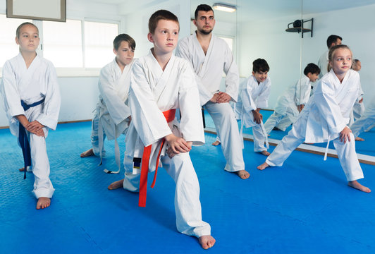 Children stretching before karate class