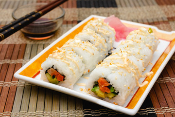 Homemade sushi rolls with salmon and cucumber.