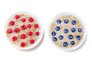 Oatmeal porridge with milk and fresh on a white isolated background