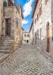 Fototapeta na wymiar Opi (Italy) - The little and suggestive stone town on the hill, in the heart of National Park of Abruzzo, Lazio and Molise. Here a view of historic center during the summer.