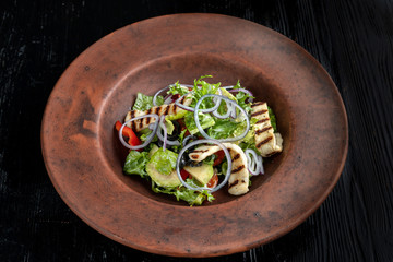 Fresh salad with grilled cheese, tomatoes, olives, lettuce and arugula-2.