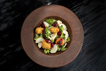 Tasty Homemade Cheese Donuts Jam, poured with pear and salad.