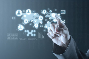 Obraz premium Business man pointing to social media network icons structure