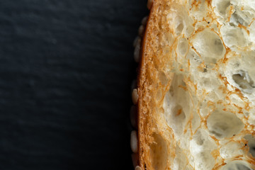 Slice of white bread roasted in a toaster.