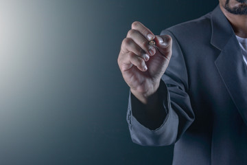 Fototapeta premium Hand of business man write or writing on the virtual touch screen