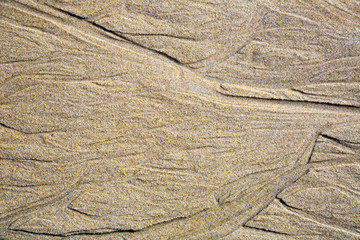 Texture background of natural sand at the beach after low tide