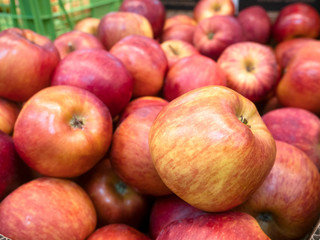 Fototapeta na wymiar Red garden seasonal apples. Selling ripe apples in the store.