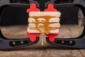 Gluing wood with waterproof adhesive. Pieces of wood pressed together with carpentry clamps.