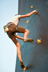 Fototapeta na wymiar Man with arms wide concentrate and prepare to wall climbing