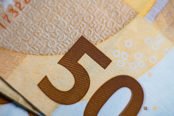 Closeup photo of a part of fifty euro. Closeup on 50 EURO banknots. Macro photo.