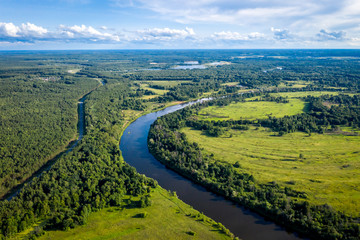 The valley of the Klyazma river in Vladimir and cars road, Russia the top view from the drone