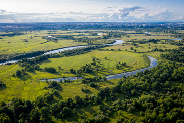 Fototapeta na wymiar aerial landscape of winding river Klyazma in green field, top view of beautiful nature texture from drone/ Vladimir city Russia