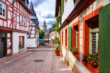 Streets of Idstein town in the Taunus area with half timbered houses on a beautiful summer-day. - obrazy, fototapety, plakaty