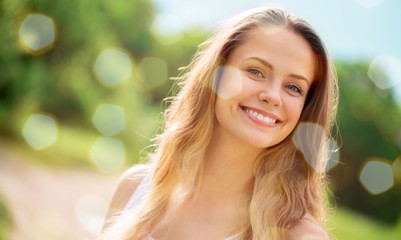 Young woman on field under sunset light