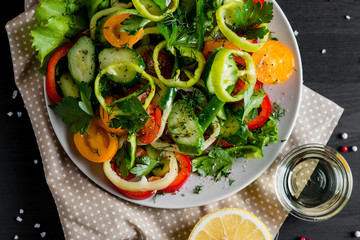 Vegetables on the plate. Sliced vegetables salad for a healthy diet. Top view. Close up.