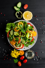 Vegetables on the plate. Sliced vegetables salad for a healthy diet. Top view.