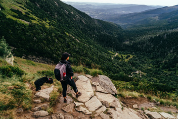Fototapeta na wymiar Young woman on the trail in Giant Mountains (Karkonosze), authentic travel experience. 