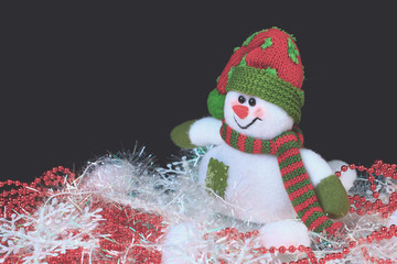 decorated with a snowman, on a black background