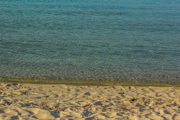 simple natural background of sand beach and calm water