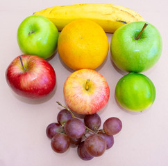 Group of ordered fruits seen from above. White background.