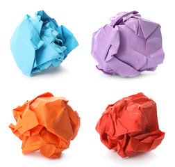Set with different paper balls on white background