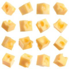 Set of delicious cheese cubes on white background