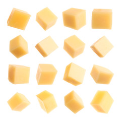 Set of delicious cheese cubes on white background
