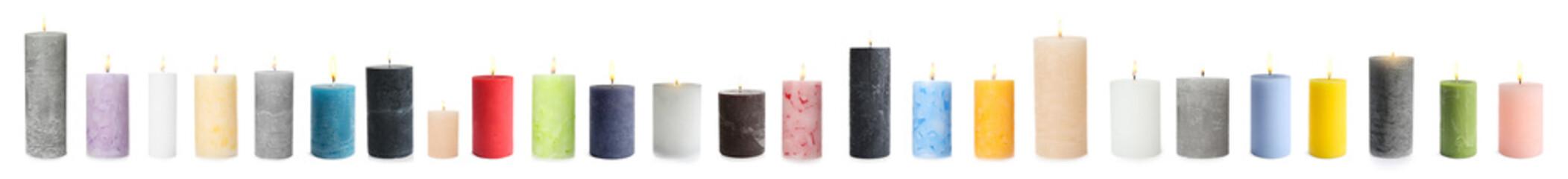 Five color wax candles on white background