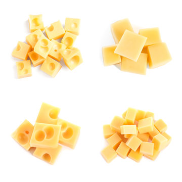 Set of different delicious cheese cubes on white background, top view