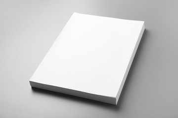Stack of blank paper sheets for brochure on grey background. Mock up