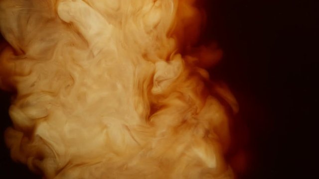 Super slow motion of pouring milk into coffee drink. Filmed on very high speed cinema camera