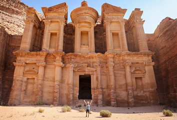Woman standing in front of the monastery at Petra in Jordan. 