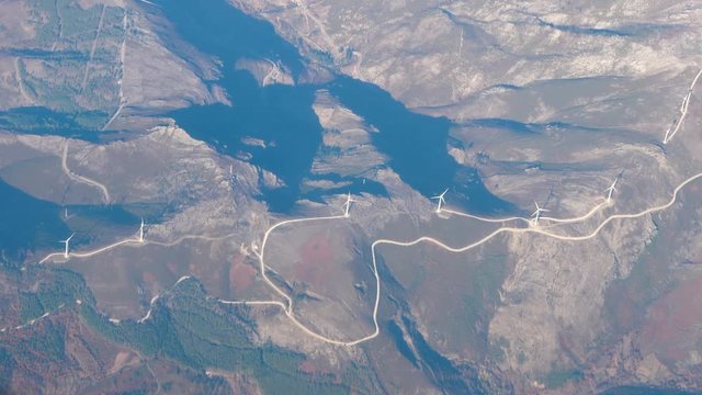 Hills with wind turbines arial view.