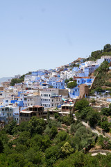 Aerial view to the old medina of the blue Chefchaouen town in Morocco, landscape.