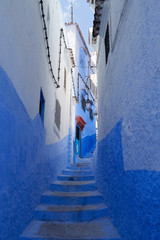 Narrow street of the old blue Chefchaouen town in Morocco.