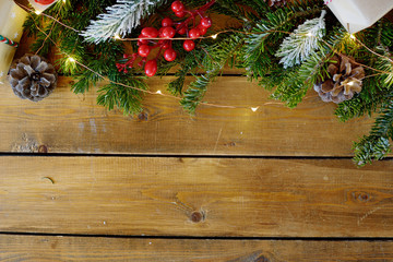 Christmas fir tree with decoration on dark wooden board