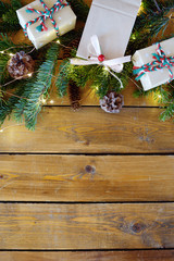 Christmas fir tree with decoration on dark wooden board